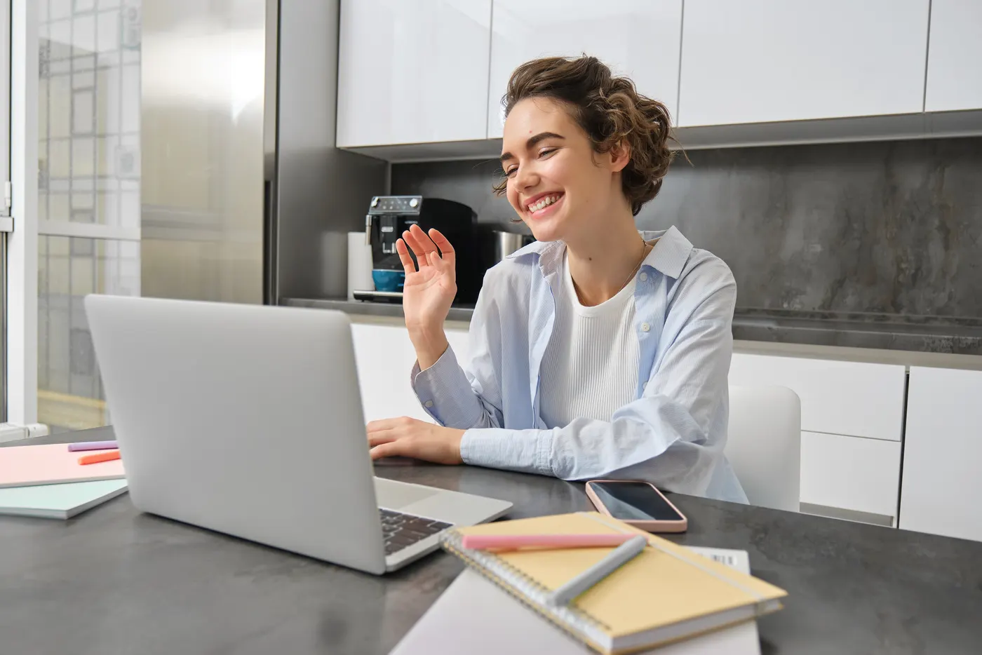 Team member on a video call from a home desk